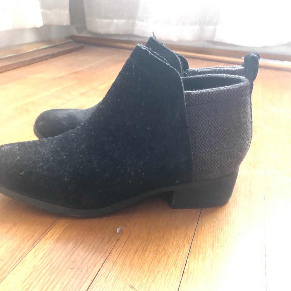 Tom’s eyelet black booties